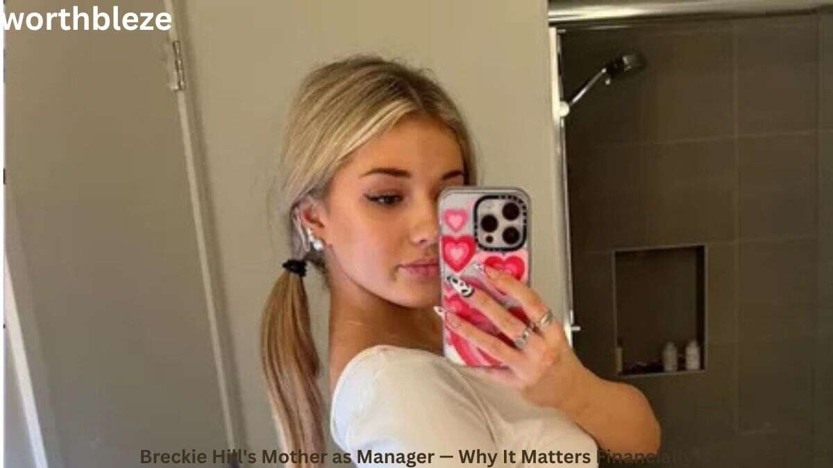 Breckie Hill taking a mirror selfie with a pink phone case, featured in a lifestyle image related to Breckie Hill Net Worth and her social media success.
