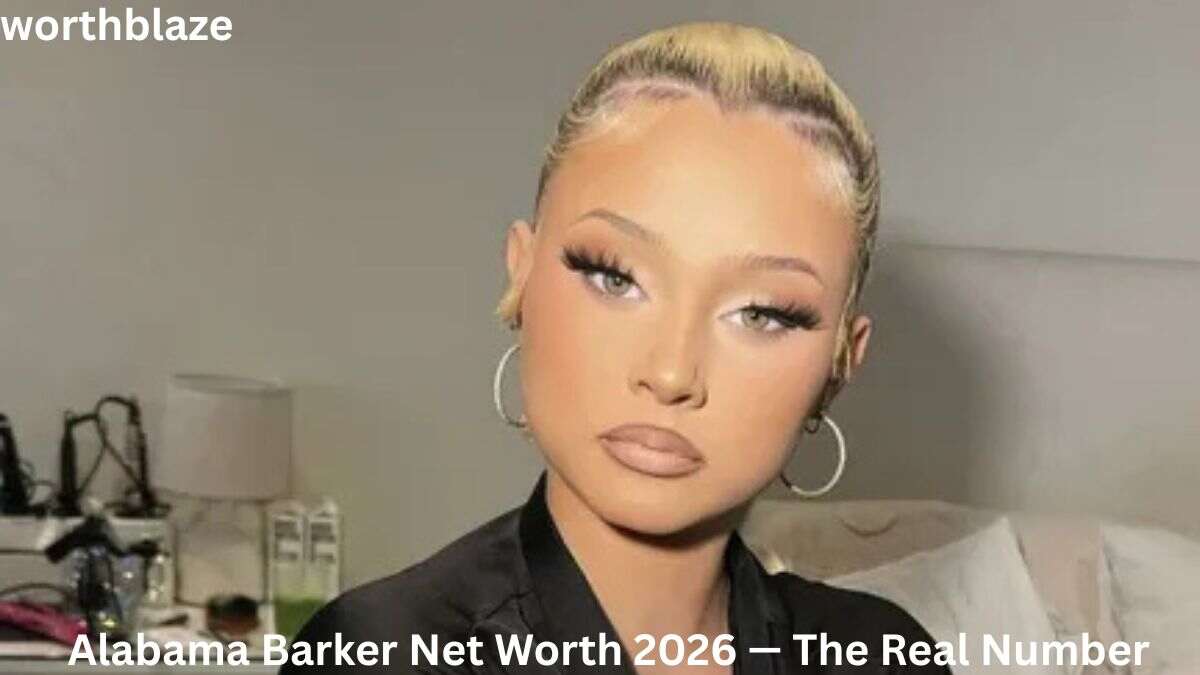 Alabama Barker posing indoors with a sleek updo hairstyle and hoop earrings, featured in an article about Alabama Barker Net Worth 2026 and her growing entertainment career.