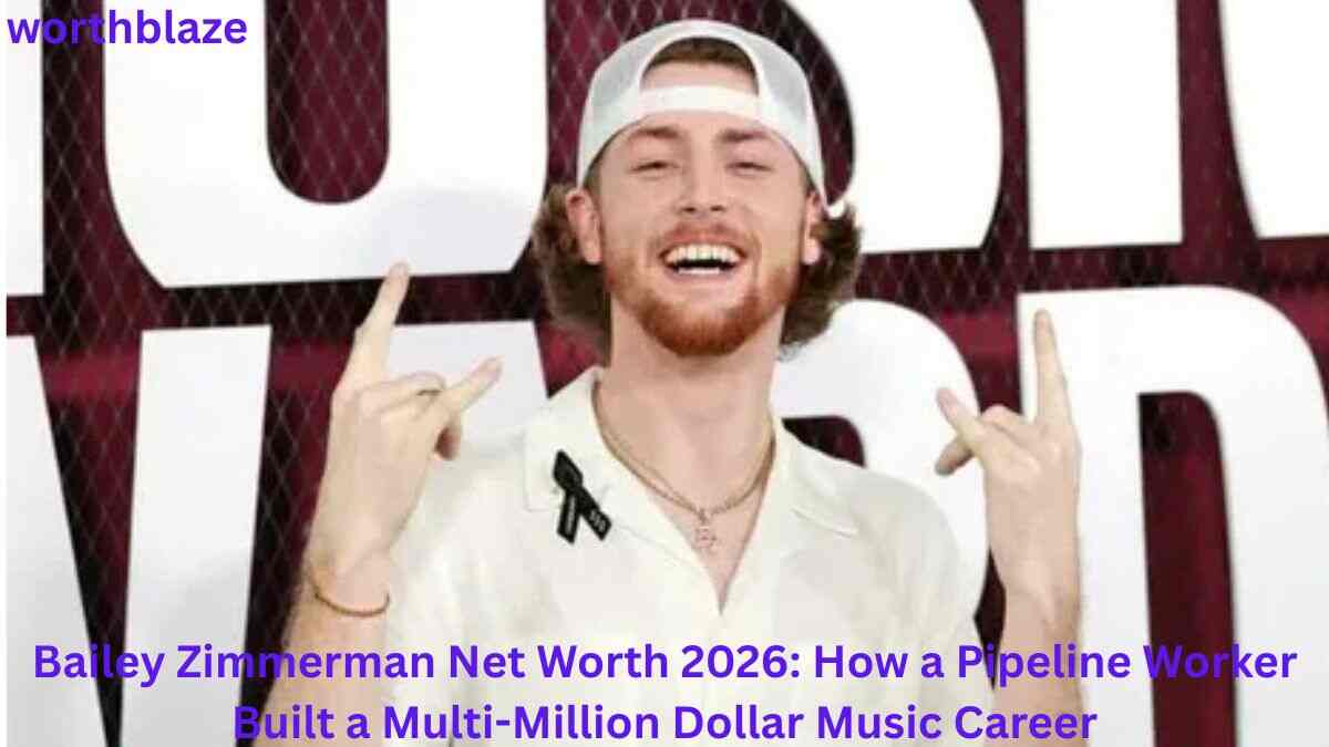 Bailey Zimmerman posing with a smile and hand gesture at a music event, showcasing the success behind Bailey Zimmerman Net Worth and his country music career.