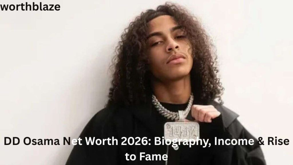 DD Osama posing in a black outfit with long curly hair and a diamond chain necklace, highlighting the success and lifestyle behind DD Osama Net Worth.
