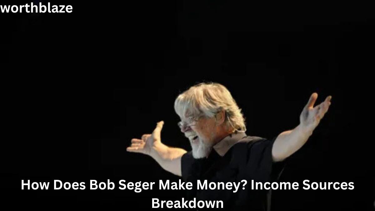 Bob Seger performing on stage with arms outstretched, illustrating the success and revenue streams that contribute to Bob Seger Net Worth.