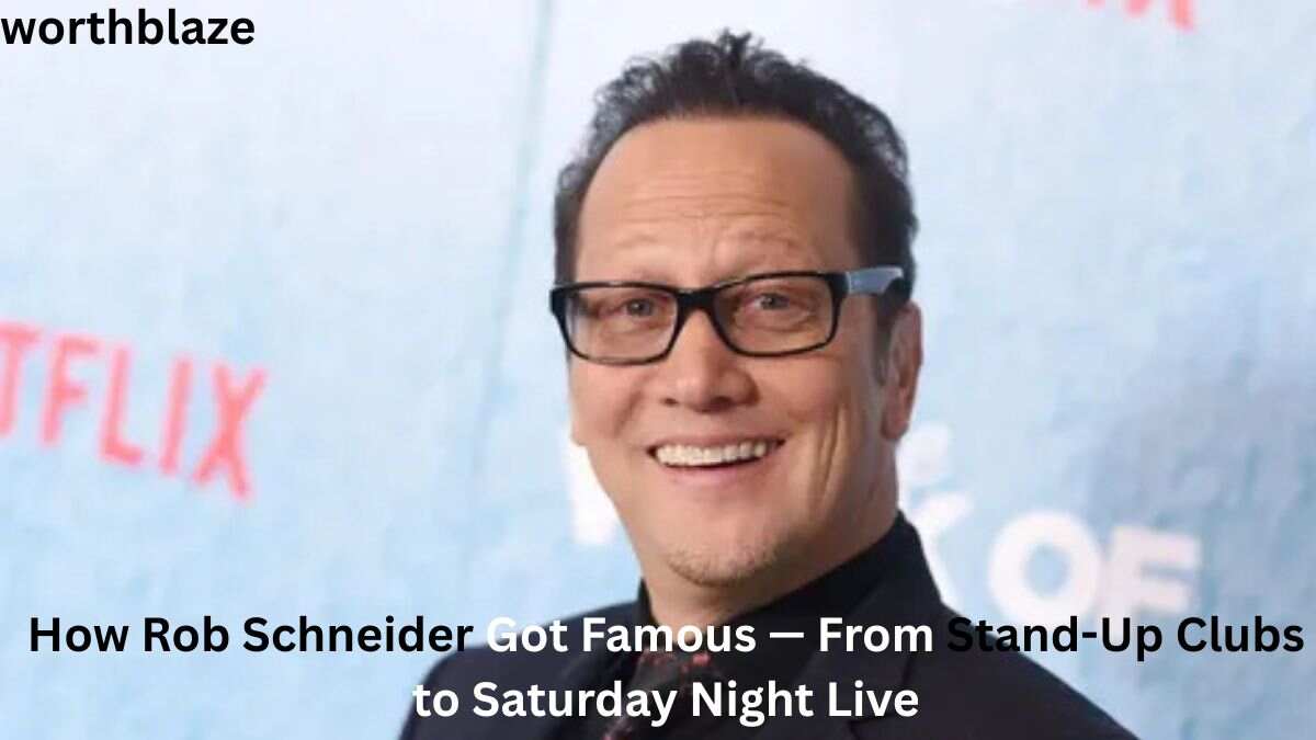 Rob Schneider smiling at a public event, featured in an article about Rob Schneider Net Worth and his rise to fame.