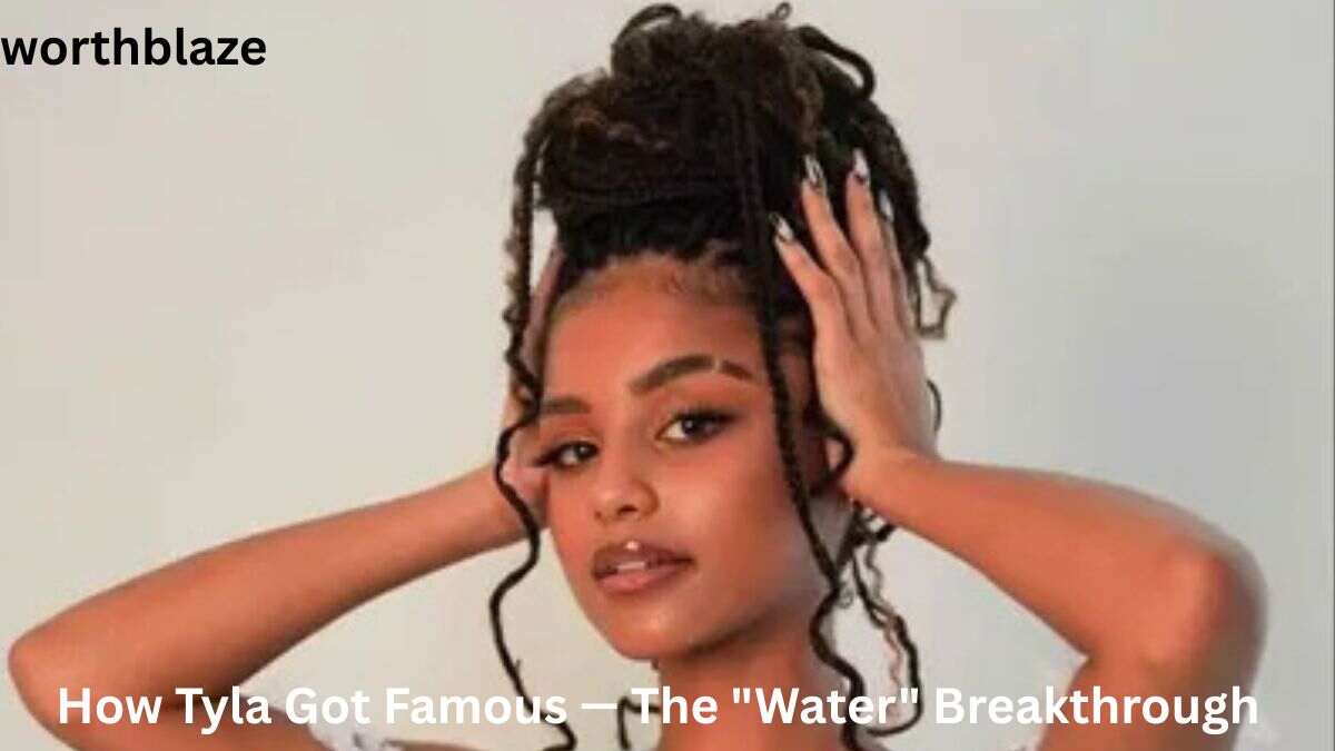 Portrait of Tyla with an updo hairstyle, featured in an article explaining how Tyla got famous through her hit song "Water" and rise to global success.
