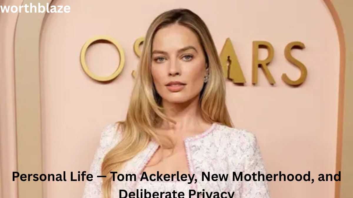 Margot Robbie posing at an awards event, offering insight into her personal life, marriage to Tom Ackerley, motherhood, and the story behind Margot Robbie Net Worth.