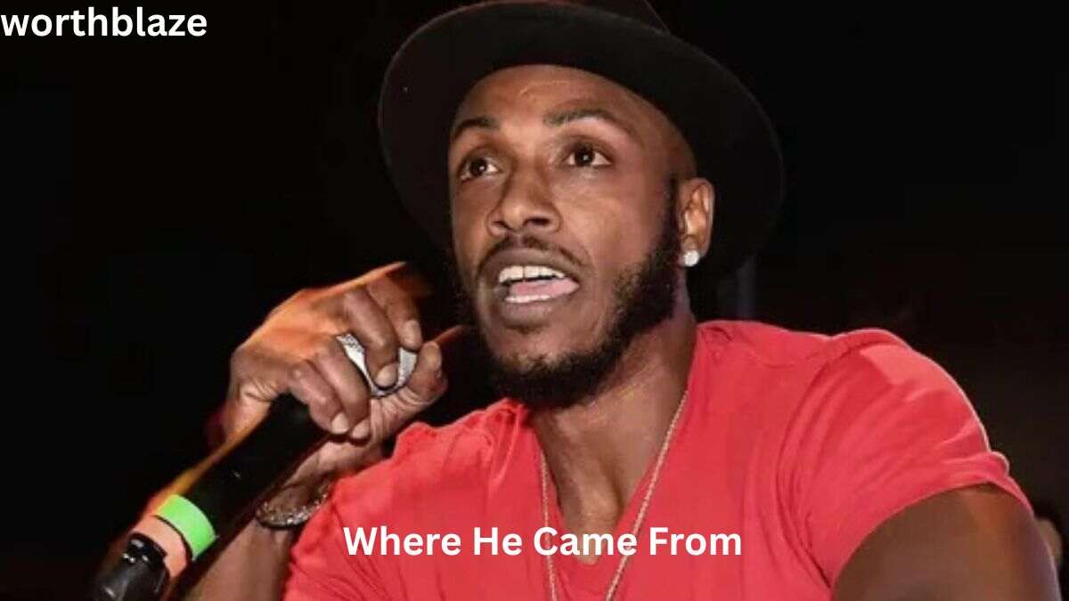 Mystikal speaking into a microphone during a live performance, featured in an article about Mystikal Net Worth and early life.