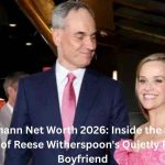 Oliver Haarmann standing with Reese Witherspoon at a public event, highlighting Oliver Haarmann Net Worth and business success.