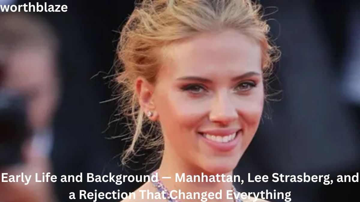 Scarlett Johansson smiling at a red-carpet event, highlighting her early life and journey before building her successful acting career and net worth.