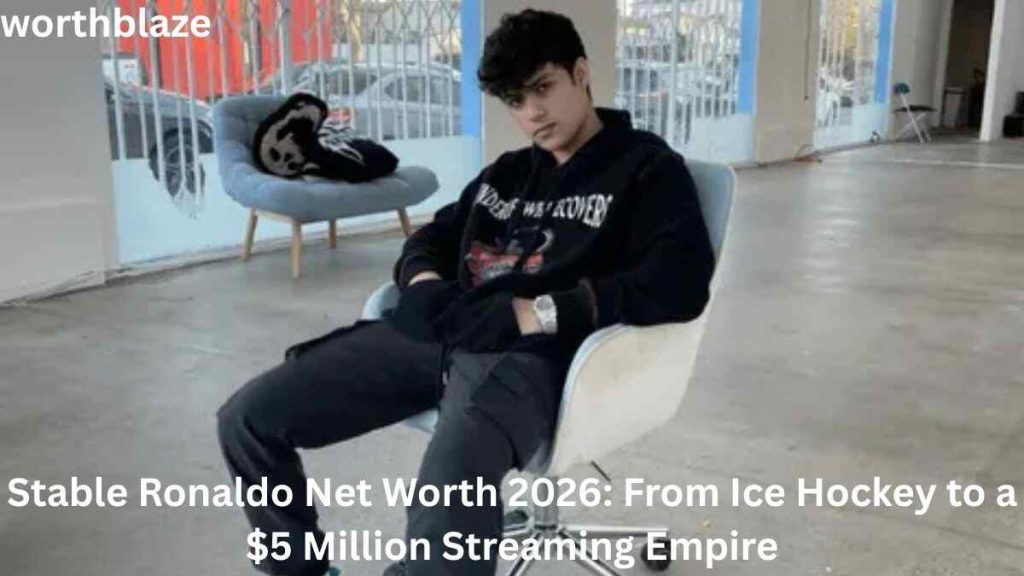 Stable Ronaldo sitting in a modern studio space wearing a black hoodie, featured in an article discussing Stable Ronaldo Net Worth 2026 and his rise to a multimillion-dollar streaming career.