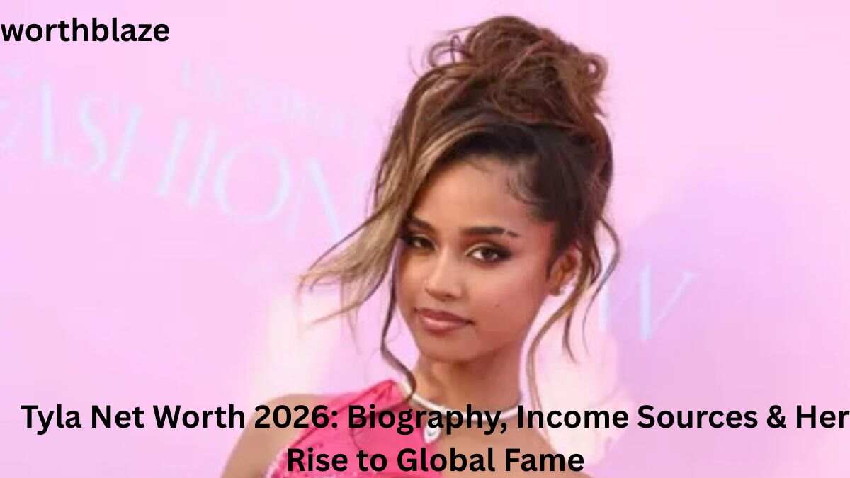 Tyla posing at a pink-themed event backdrop, featured in an article about Tyla net worth, career success, and income sources in 2026.