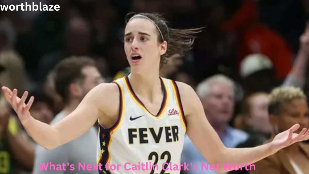 Caitlin Clark reacts during an Indiana Fever game as fans look on, highlighting Caitlin Clark Net Worth and her growing impact on women's basketball.