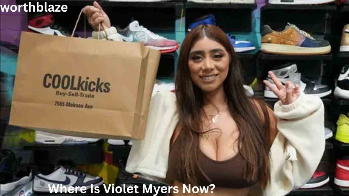 Violet Myers posing with a shopping bag in a sneaker store, featured in an article about where Violet Myers is now and her current activities.