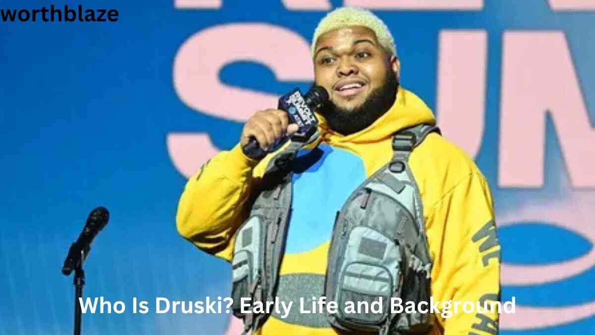 Druski speaking on stage during a live event, highlighting his journey to success and the growth of Druski Net Worth through comedy and entertainment.